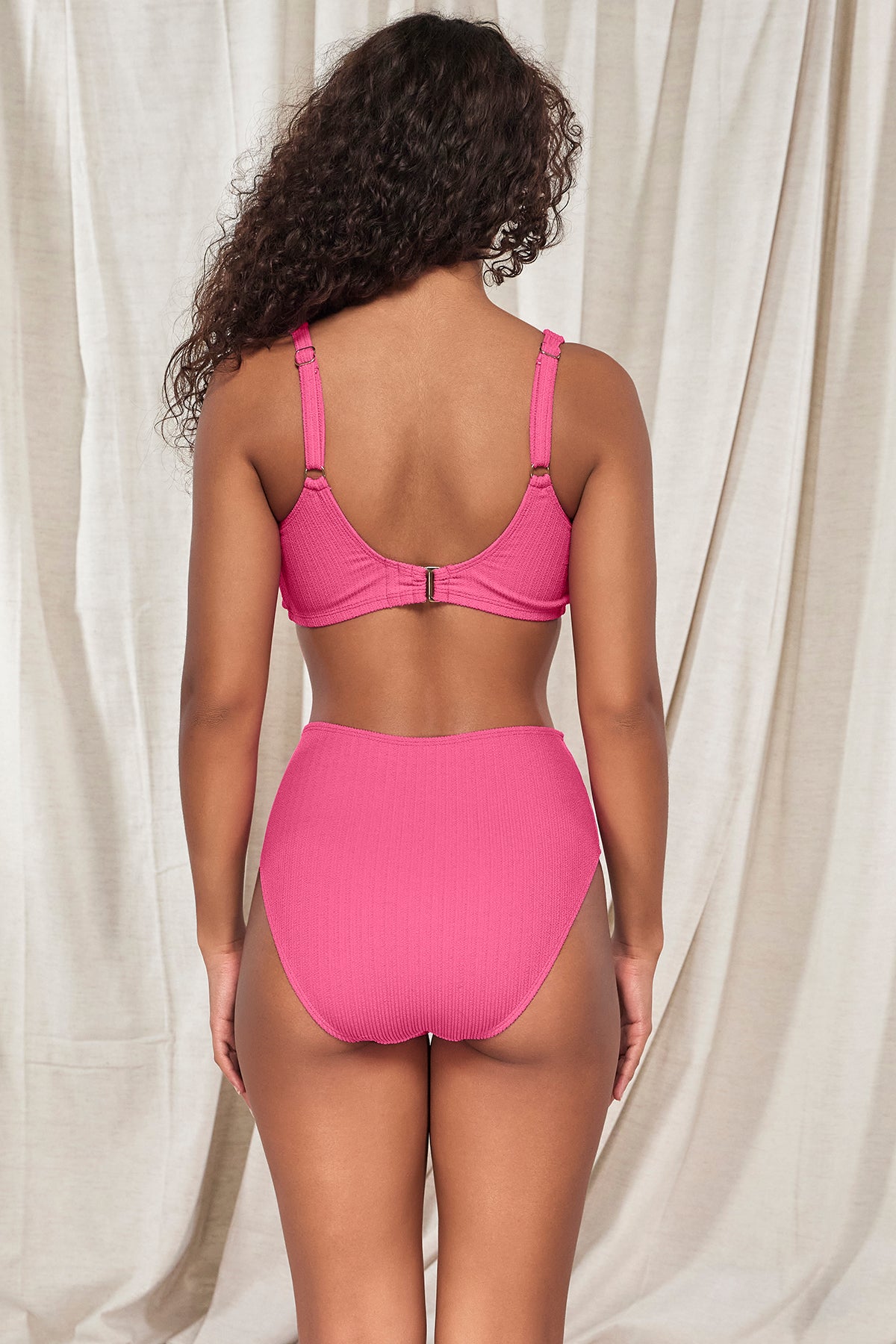 Back pose #1 of Jasmine wearing Pacifica Dragon Fruit Astrid High Waist Bottom paired with matching