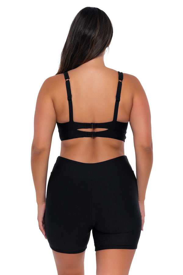 Back pose #1 of Nicky wearing Sunsets Black Danica Top with matching Bayside Bike Short swim bottom