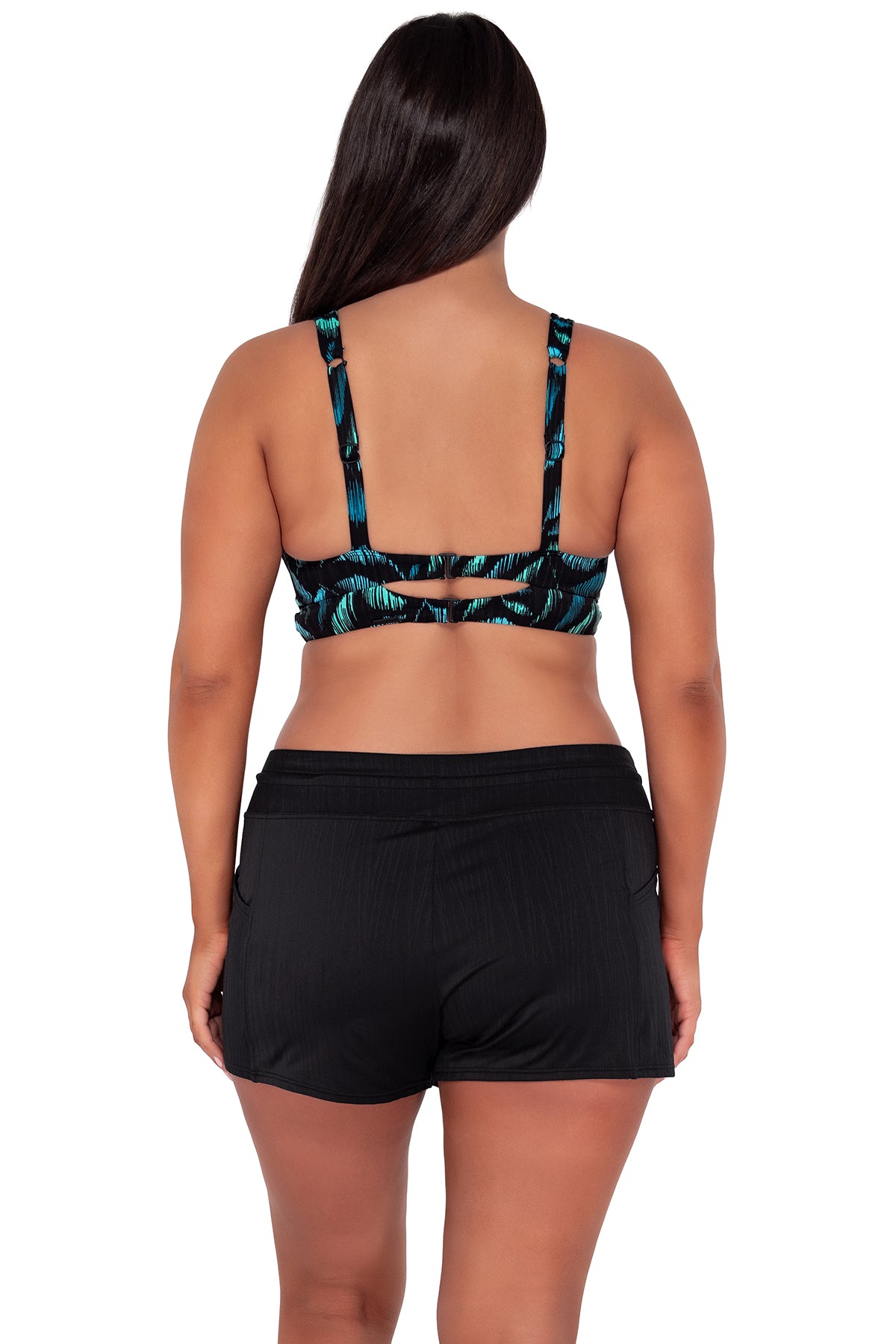 Back pose #1 of Nicki wearing Sunsets Cascade Seagrass Texture Danica Top paired with Laguna Swim Short women's casual wear