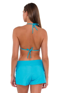 Back pose #1 of Daria wearing Sunsets Escape Blue Bliss Laguna Swim Short with matching Laney Triangle bikini top