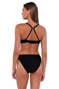 Back pose #1 of Daria wearing Sunsets Black Juliette Underwire Top showing crossback straps with matching Kylie Hipster bikini bottom