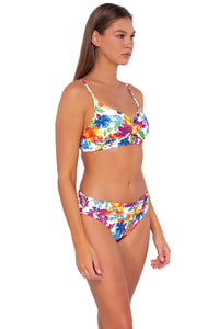 Side pose #1 of Daria wearing Sunsets Camilla Flora Unforgettable Bottom with matching Lyla Bralette bikini top