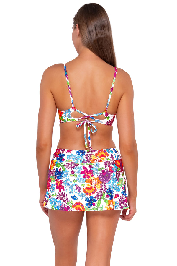 Back pose #1 of Daria wearing Sunsets Camilla Flora Sporty Swim Skirt with matching Lyla Bralette bikini top