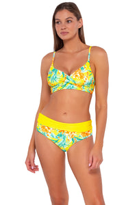 Front pose #1 of Daria wearing Sunsets Golden Tropics Sandbar Rib Capri High Waist Bottom showing folded waist with matching Lyla Bralette bikini top .