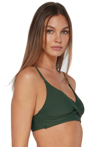 Quarter pose #2 of Daria wearing Sunsets Island Green Lyla Bralette Top