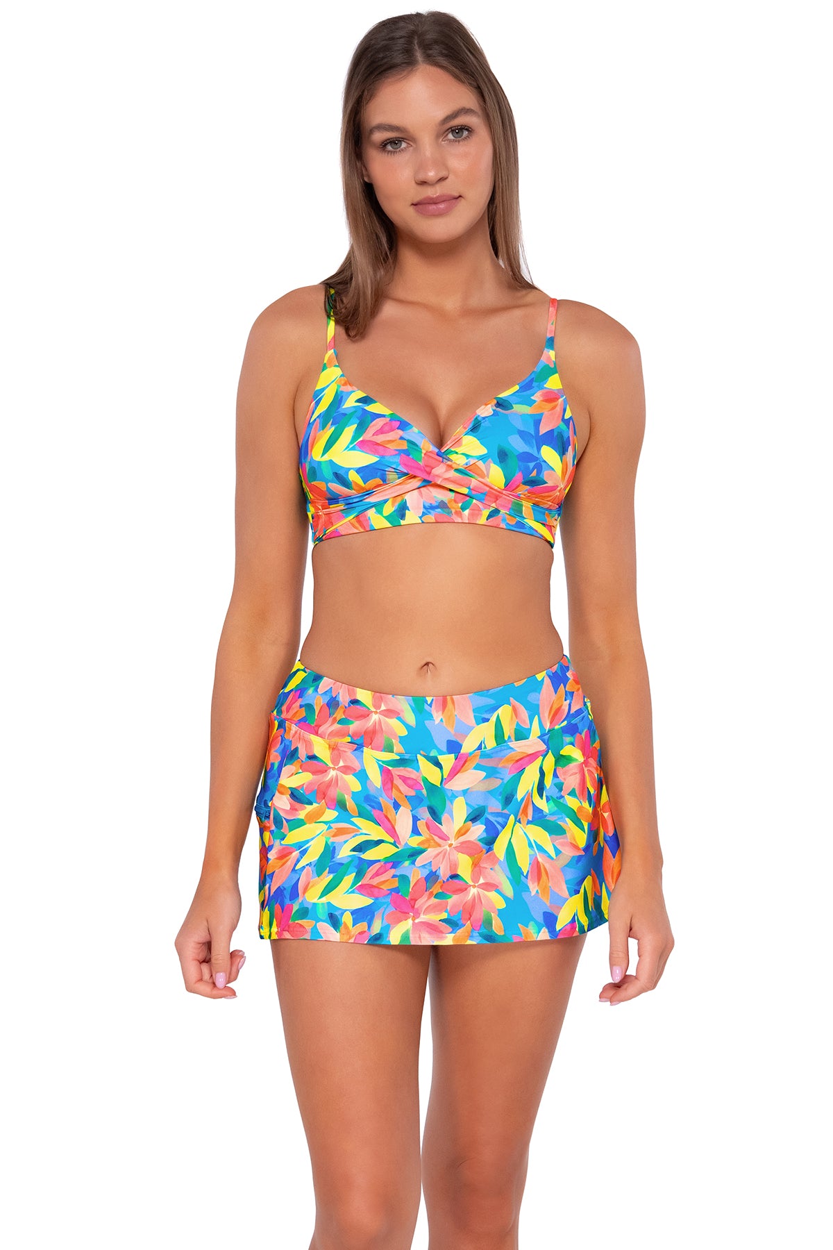 Front pose #1 of Daria wearing Sunsets Shoreline Petals Sporty Swim Skirt with matching Lyla Bralette bikini top