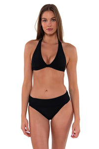 Front pose #1 of Daria wearing Sunsets Black Hannah High Waist Bottom showing folded waist with matching Faith Halter bikini top
