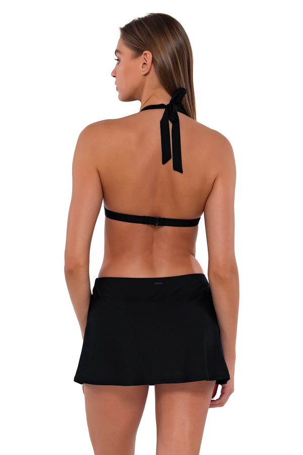 Back pose #1 of Daria wearing Sunsets Black Sporty Swim Skirt with matching Faith Halter bikini top