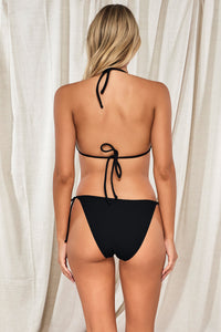 Back pose #1 of Jessica wearing Pacifica Black Tiana Triangle Top paired with matching Taryn Tide Side Bikini Bottom