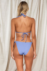 Back pose #1 of Jessica wearing Pacifica Hydrangea Tiana Triangle Top paired with matching Taryn Tie Side Bikini Bottom