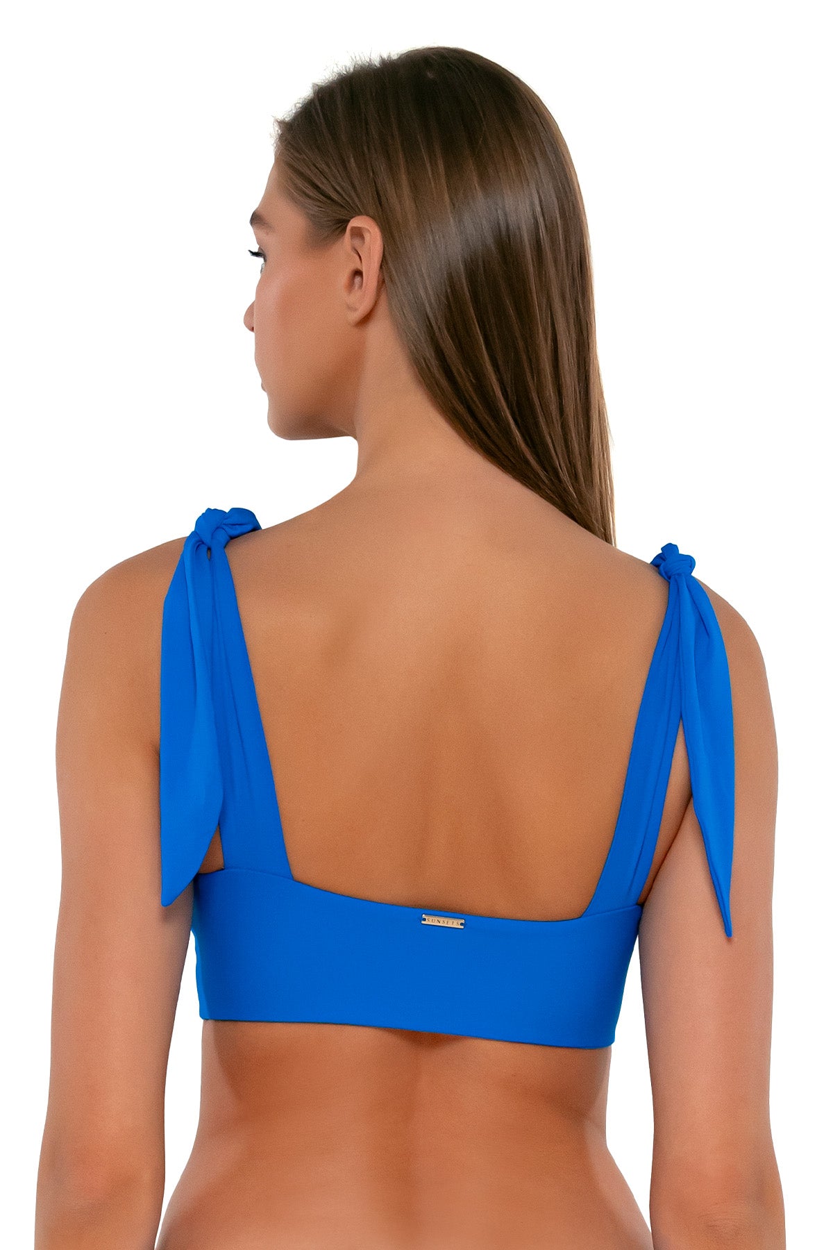 Back pose #1 of Daria wearing Sunsets Electric Blue Lily Top