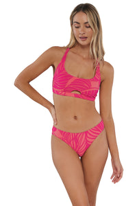 Active pose #1 of Jessica wearing Sunsets Blushing Palms Sandbar Rib Brandi Bralette Top