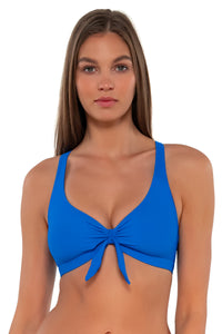 Front pose #1 of Daria wearing Sunsets Electric Blue Brandi Bralette Top showing bralette front tie