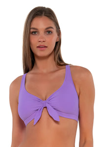 Front pose #1 of Daria wearing Sunsets Passion Flower Brandi Bralette Top showing bralette front tie
