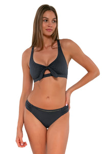 Front pose #1 of Daria wearing Sunsets Slate Seagrass Texture Brandi Bralette Top showing keyhole front tie with matching Audra Hipster bikini bottom