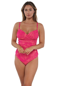 Active pose #1 of Taylor wearing Sunsets Blushing Palms Sandbar Rib Serena Tankini Top