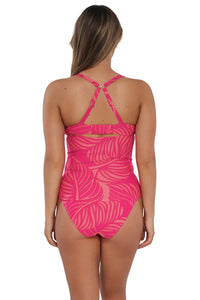 Back pose #1 of Taylor wearing Sunsets Blushing Palms Sandbar Rib Serena Tankini Top showing crossback straps