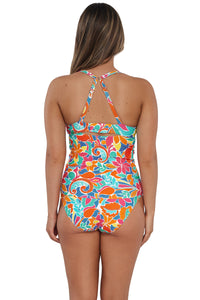 Back pose #1 of Taylor wearing Sunsets Festive Floral Sandbar Rib Serena Tankini Top showing crossback straps