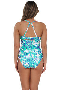 Back pose #1 of Taylor wearing Sunsets Sea Breeze Sandbar Rib Serena Tankini Top showing crossback straps