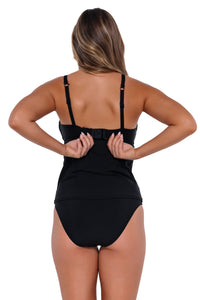 Back pose #1 of Taylor wearing Sunsets Black Maeve Tankini Top showing hidden hook-and-eye closure with matching High Road Bottom bikini