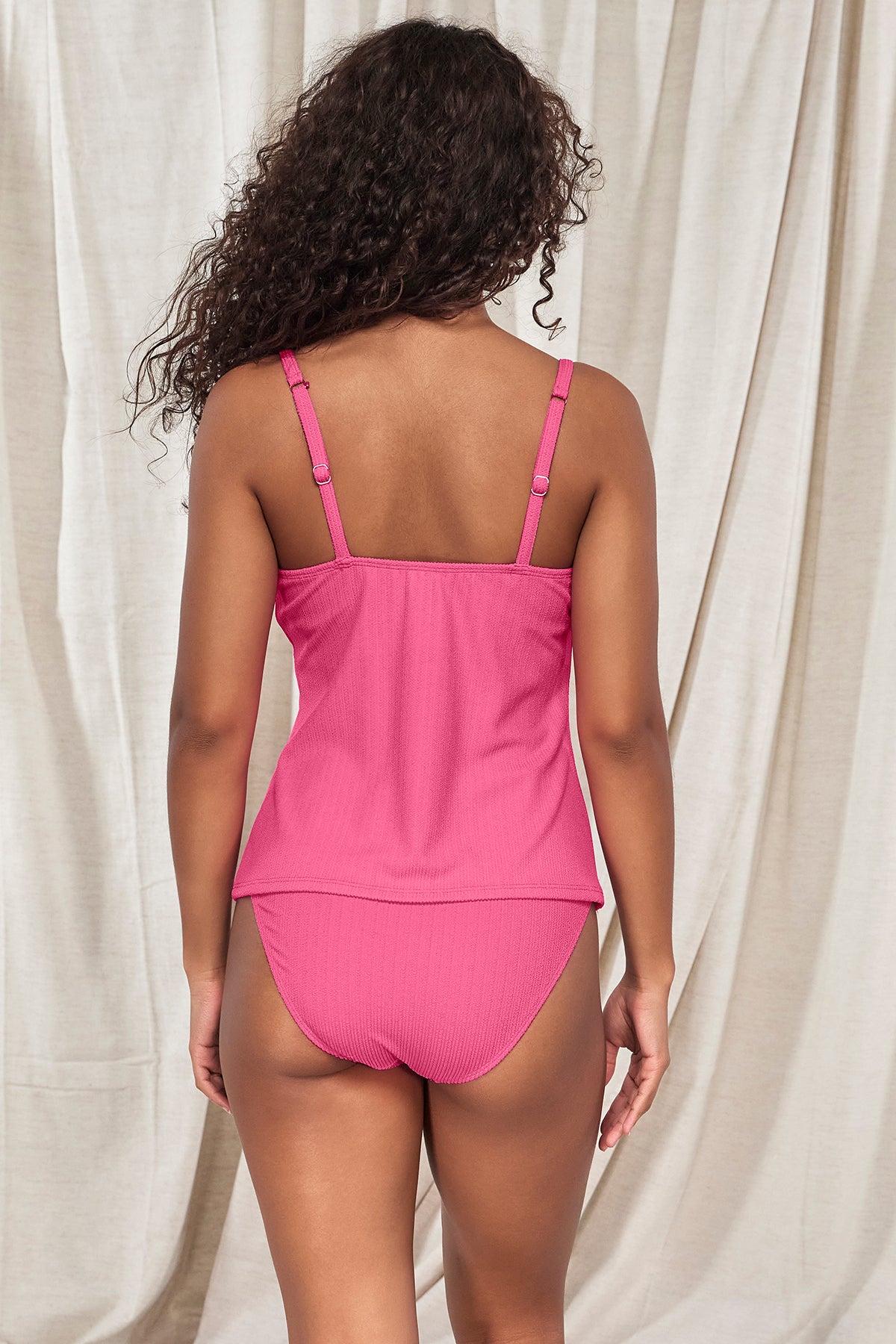 Back pose #1 of Jasmine wearing Pacifica Dragon Fruit Coralie Tankini Top