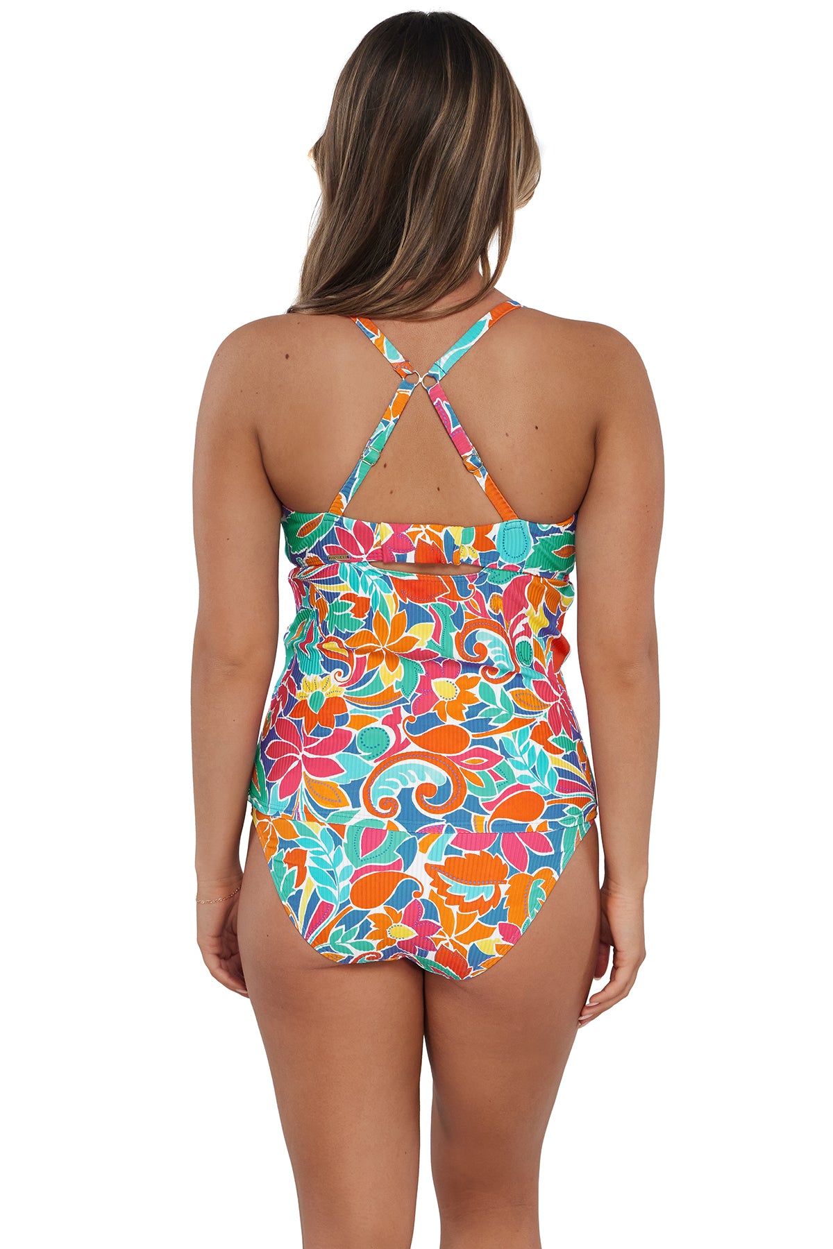 Back pose #1 of Taylor wearing Sunsets Festive Floral Sandbar Rib Zuri V-Wire Tankini Top showing crossback straps