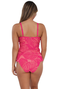 Back pose #1 of Taylor wearing Sunsets Blushing Palms Sandbar Rib Forever Tankini Top