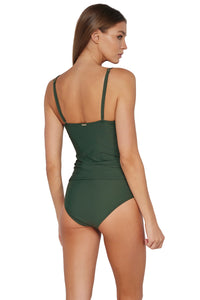 Oblique pose #1 of Daria wearing Sunsets Island Green Simone Tankini Top paired with matching Capri High Waist Bottom