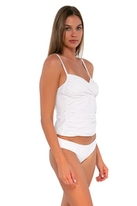 Side pose #1 of Daria wearing Sunsets White Lily Simone Tankini Top with matching Alana Reversible Hipster bikini bottom