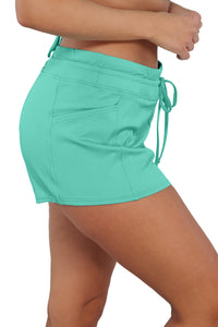 Quarter pose #1 of Nicki wearing Sunsets Escape Aqua Mist Sandbar Rib Laguna Swim Short