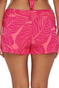 Back pose #1 of Nicki wearing Sunsets Escape Blushing Palms Sandbar Rib Laguna Swim Short