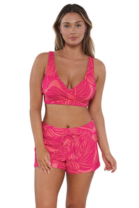 Front pose #2 of Taylor wearing Sunsets Escape Blushing Palms Sandbar Rib Laguna Swim Short paired with matching