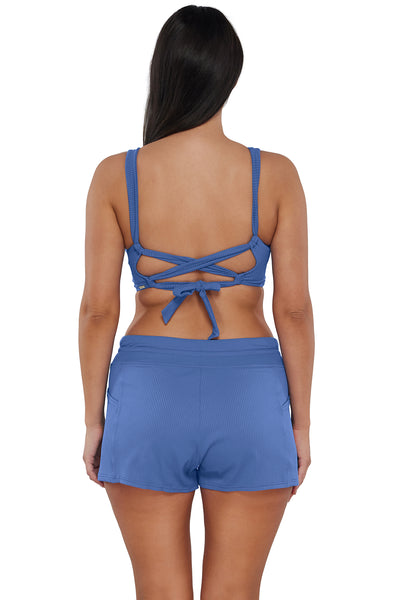 Back pose #1 of Nicki wearing Sunsets Escape Harbor Blue Sandbar Rib Laguna Swim Short paired with matching Bikini Top
