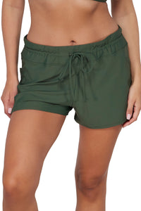 Front pose #1 of Nicki wearing Sunsets Escape Island Green Laguna Swim Short Bottom