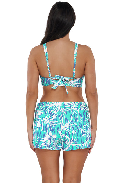 Back pose #1 of Nicki wearing Sunsets Escape Sea Breeze Sandbar Rib Laguna Swim Short paired with matching Bikini Top