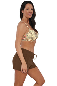 Quarter pose #1 of Nicki wearing Sunsets Escape Tiki Brown Laguna Swim Short paired with matching