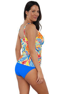 Oblique pose #1 of Nicki wearing Sunsets Escape Suncatcher Emerson Tankini Top paired with coordinating Electric Blue Hannah High Waist