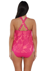 Back pose #1 of Nicki wearing Sunsets Escape Blushing Palms Sandbar Rib Sadie Tankini Top showing crossback straps