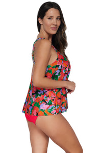 Oblique pose #1 of Nicki wearing Sunsets Escape Hummingbird Cove Sadie Tankini Top paired with coordinating Geranium Hannah High Waist Bottom