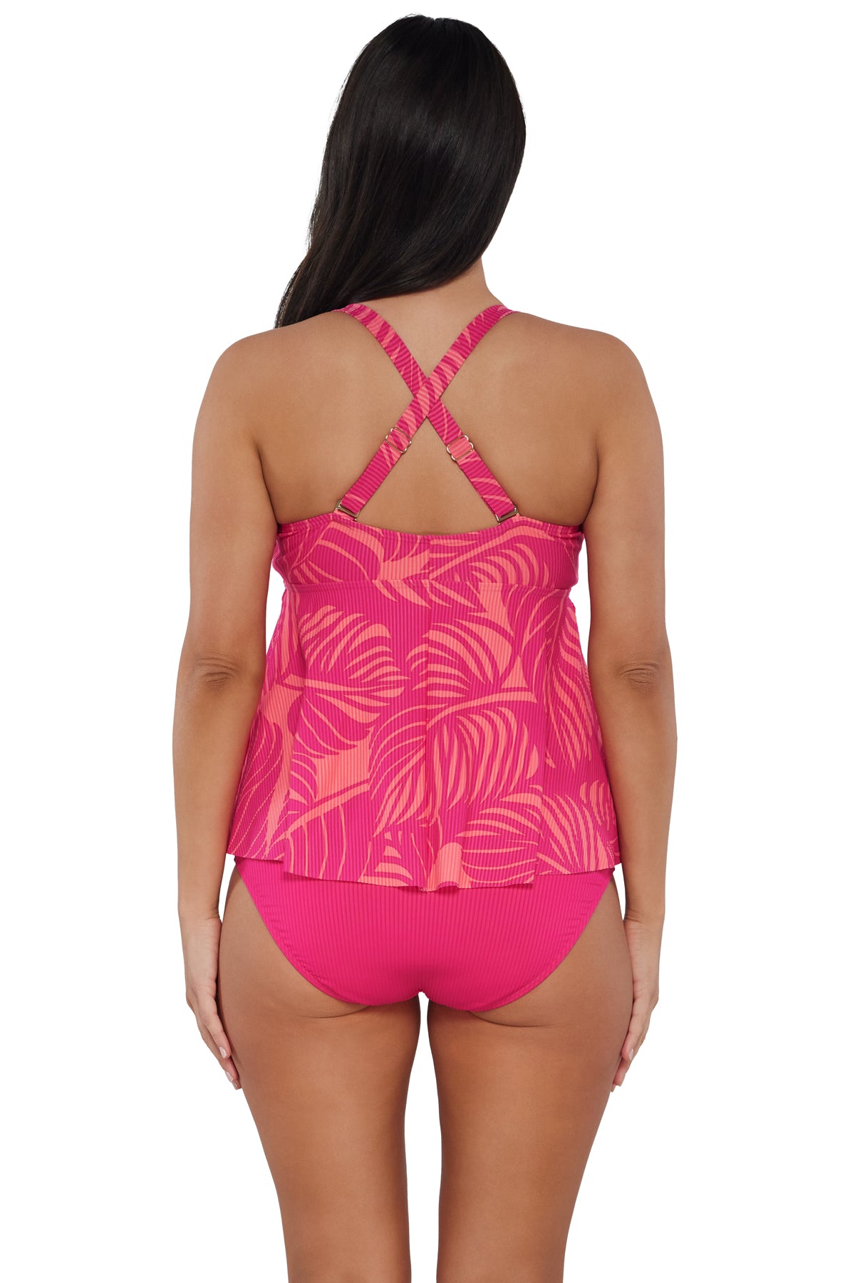 Back pose #1 of Nicki wearing Sunsets Escape Blushing Palms Sandbar Rib Marin Tankini Top showing crossback straps