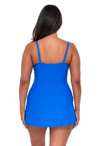 Back pose #1 of Nicky wearing Sunsets Escape Electric Blue Sienna Swim Dress