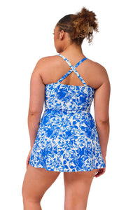 Back pose #1 of Haviland wearing Sunsets Escape Chelsea Petals Sienna Swim Dress showing crossback
