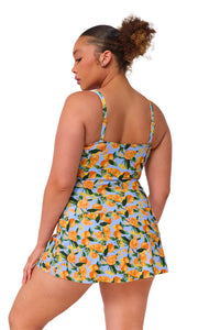 Oblique pose #1 of Haviland wearing Sunsets Escape Clementine Sienna Swim Dress