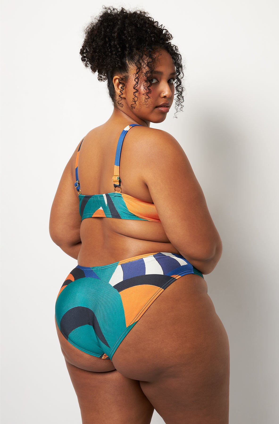 Back pose #1 of Lydia wearing Villa Fresca Tuscan Waves Vista Bikini Bottom paired with