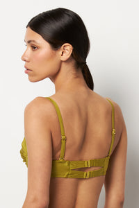 Back pose #1 of Alexa wearing Villa Fresca Shiny Olive Sofia Bikini Top