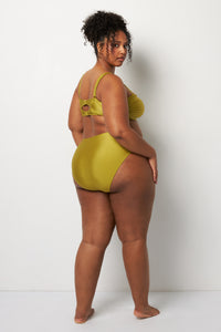 Back pose #1 of Lydia wearing Villa Fresca Shiny Olive Sofia Bikini Bottom paired with