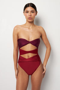 Front pose #1 of Alexa wearing Villa Fresca Fig Mia Twisted One-Piece showing removable straps