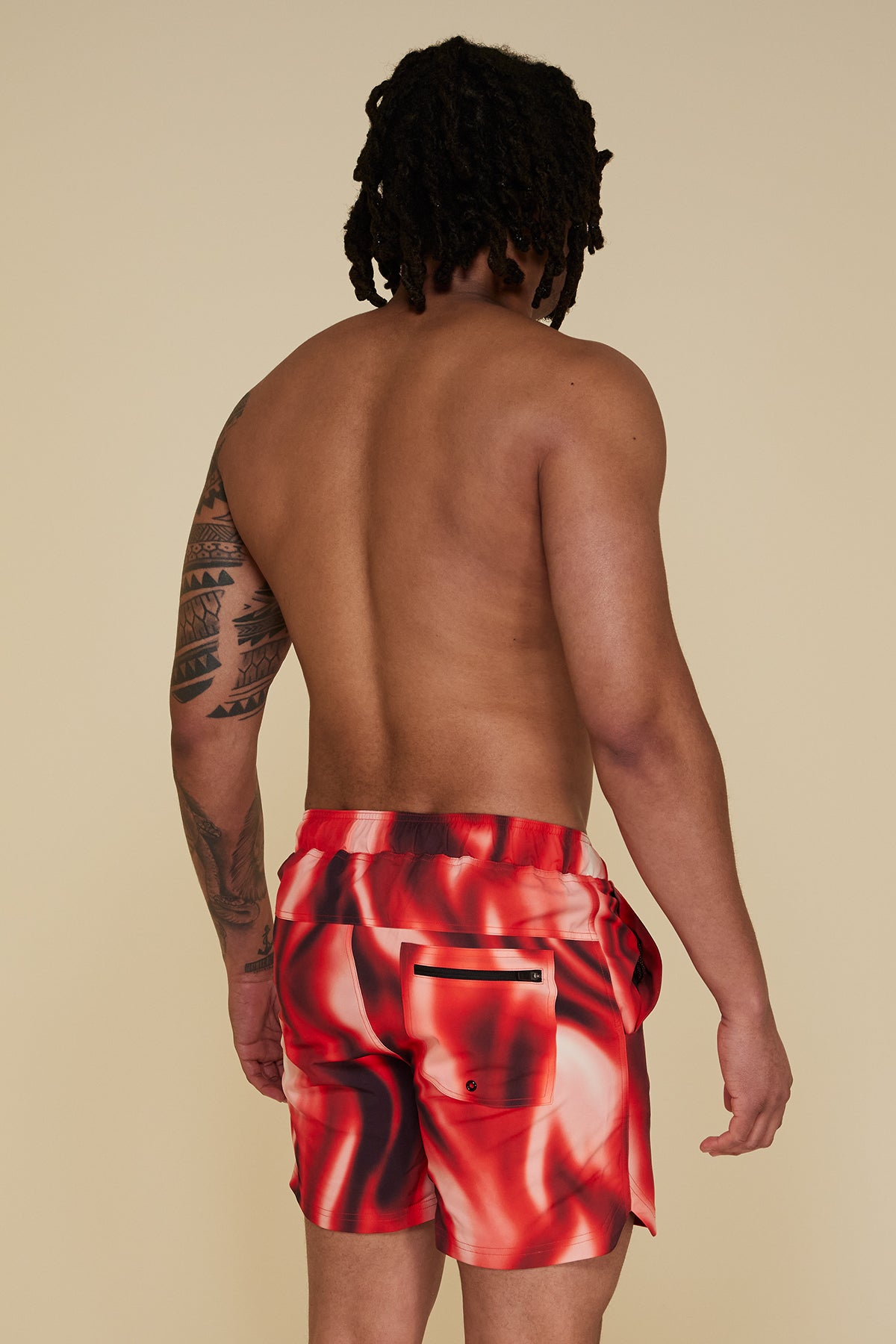 Oblique pose #1 of Jon wearing B Swim Trade Winds Bermuda Board Short 