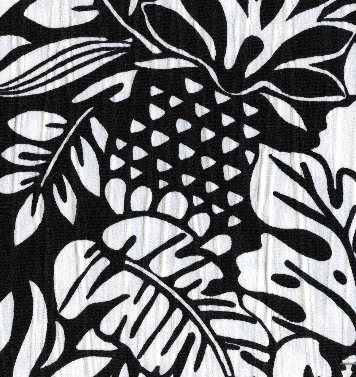 Sunsets Caribbean Seagrass Texture black-and-white tropical print featuring hibiscus and pineaples on a textured fabric
