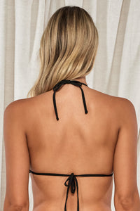 Back pose #1 of Jessica wearing Swim Systems Black Pom Pom Triangle Top